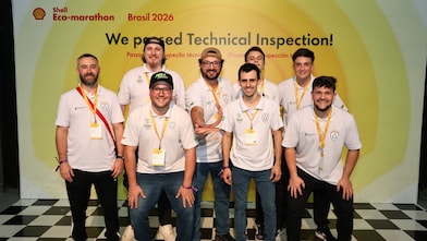 Shell Eco-marathon Brazil 2026 team posing in front of a “We Passed Technical Inspection!” event backdrop.