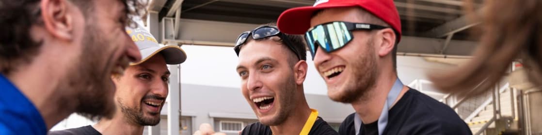 European team celebrating Shell Eco-marathon competition in the paddocks area