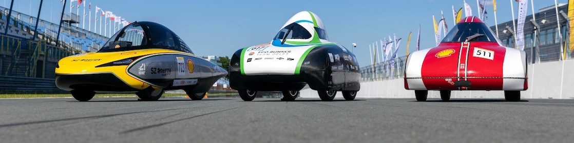three Shell Eco-marathon vehicles lined up on track