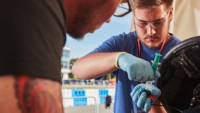 Engineers work on car