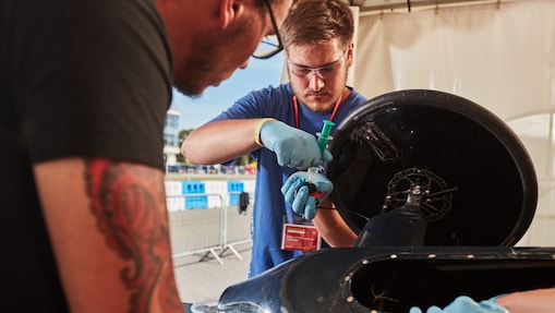 Engineers work on car