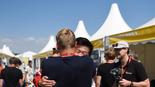 Two students hugging