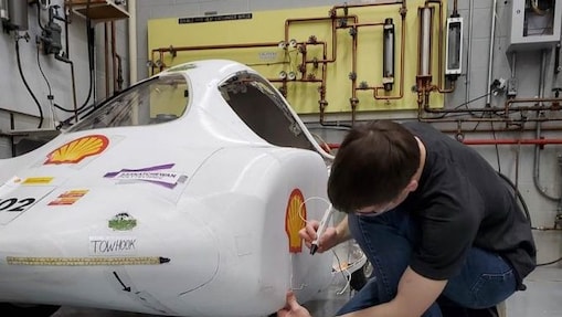 Student working on car