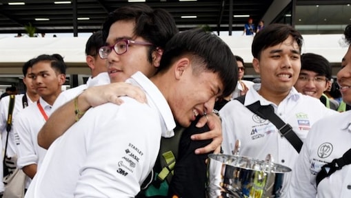 Team hugging after winning award