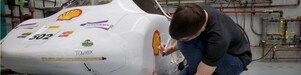 Student working on car