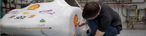 Student working on car