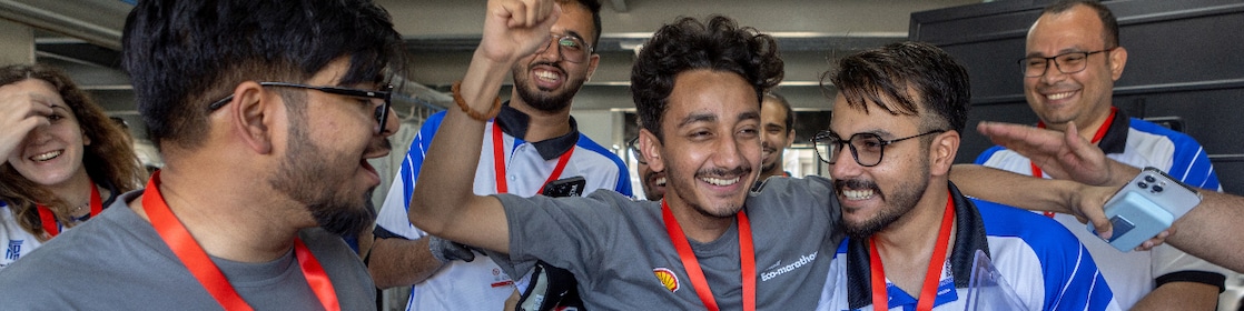 A group of young Middle-Eastern people celebrating at Shell Eco-marathon