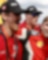A group of men in red uniforms, celebrating