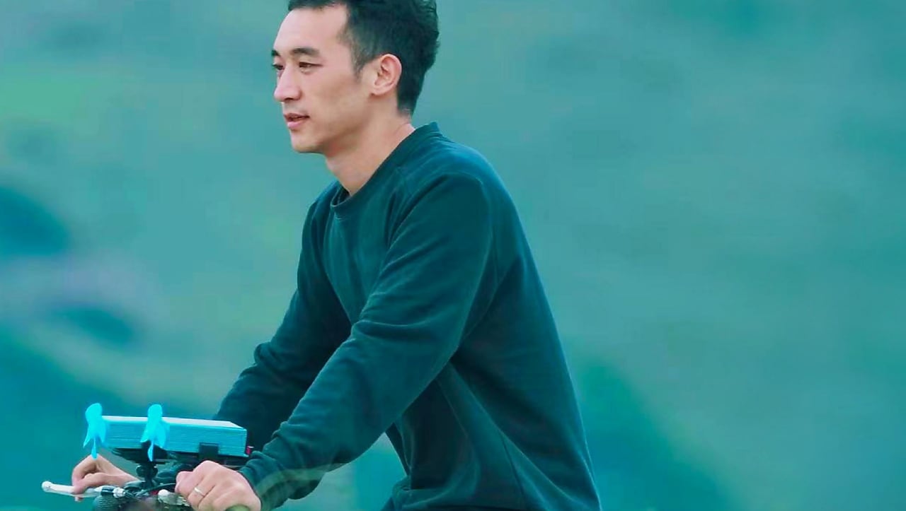 A person outdoors riding a bike