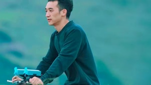 A person outdoors riding a bike