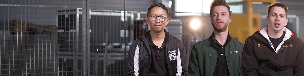 Three young adults, sitting in a track paddock, speaking straight at the camera.