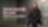Young person with glasses, talking inside a racetrack paddock