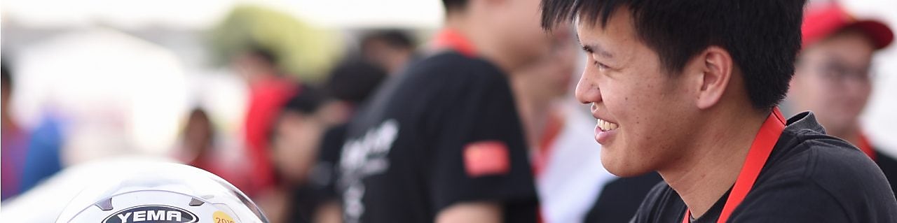 boy smiling while talking