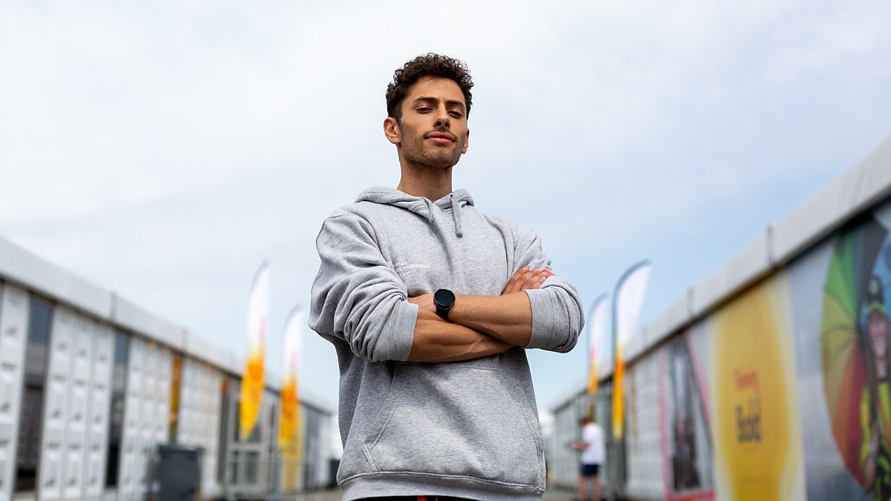 A person standing with his arms crossed