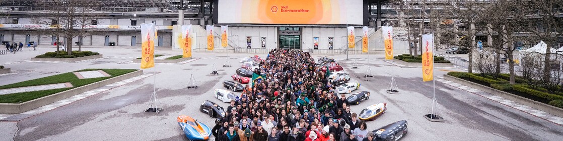 A group of people and prototype vehicles standing together at an engineering competition