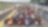 A group of people and prototype vehicles standing together at an race track