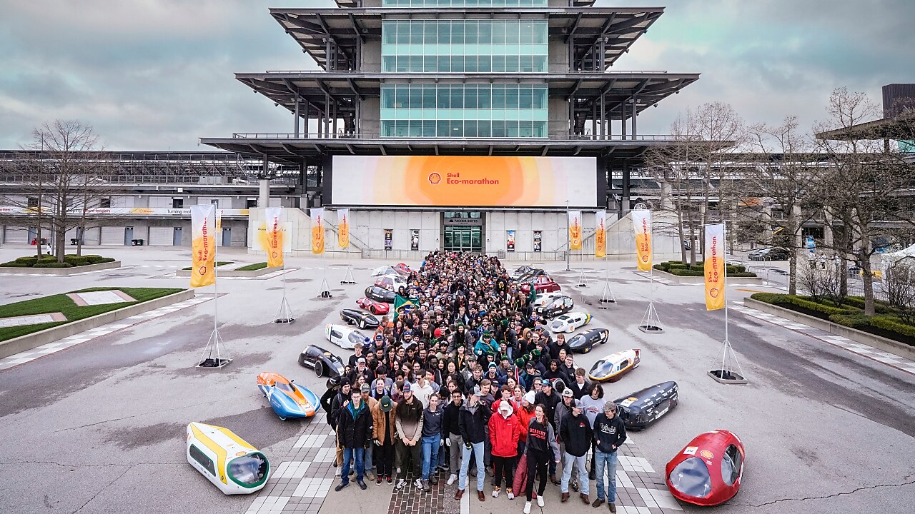 A group of people and prototype vehicles standing together at an engineering competition