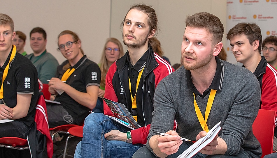 Man points at paper pad