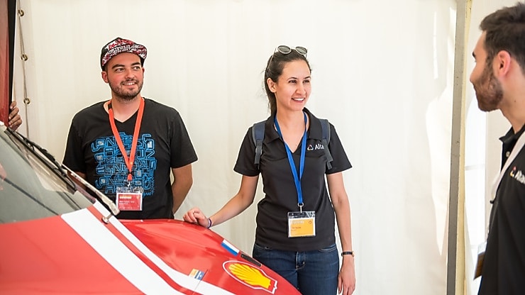 Shell Eco-marathon team stand around red car